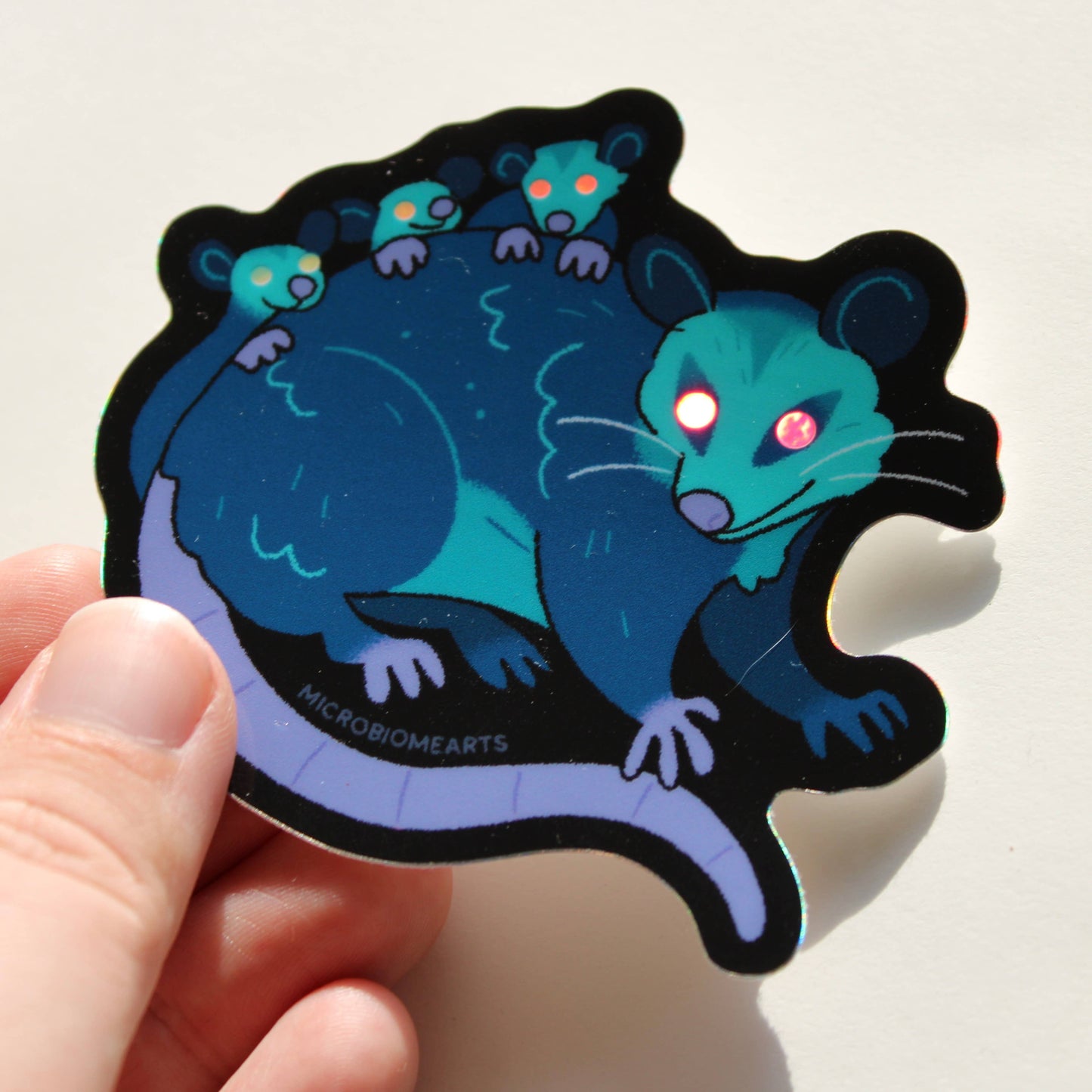 Glowing Eye Opossums Holo 3.5” Sticker
